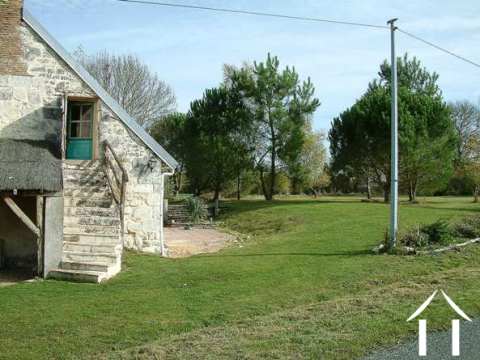 A side view of the property taken from the quiet country lane that runs past the cottage.