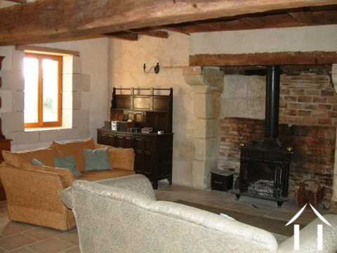 The lounge area of the sejour centres around the large fireplace and its wood burning stove.