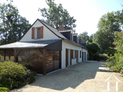 The house is classically styled with an ardoise slate roof and feature lucarnes (dormer windows). The house hs modern, hardwood double glazing throughout. In effect, the left side of the property (furthest in the picture) can be divided from the rest of the house to create a separate apartment/gîte) with its own access and terraces overlooking the garden. It has been renovated with this possibility in mind.