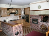 The kitchen (35m2) is both spacious, distinctive and has many character features including a feature breadoven and a inserted wood burner.