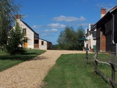 The main entrance to the property is through the surrounding orchards. Here we can see the barn and the house (to the right) and the gîte to the left of the gravel courtyard.