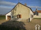 Constructed in tuffeau limestone, the property has a terra-cotta tiled roof. It has garden on three sides and is part of a small hamlet.