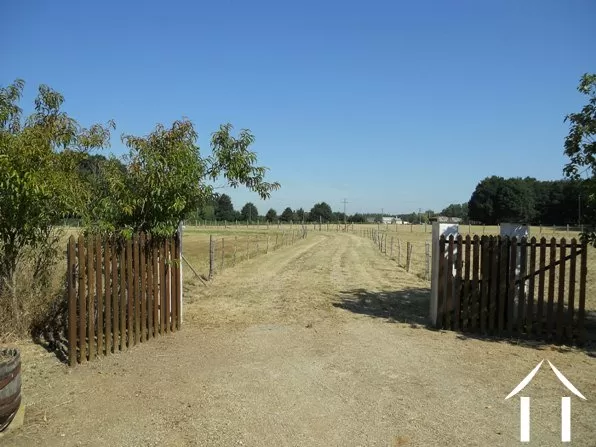 The approach is a long driveway that cuts through the 7.5 acres of ground that surround the house.