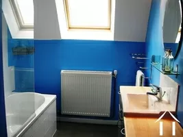 The modern bathroom in the gîte with bath (with shower over).