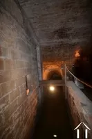 water flowing through the mill, next to the "wine cellar"