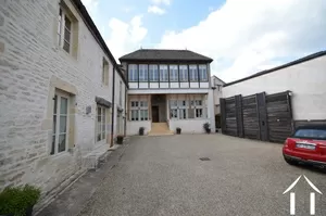 Main building as seen from gates, parking space to the right