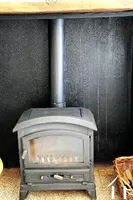 Wood burner in kitchen