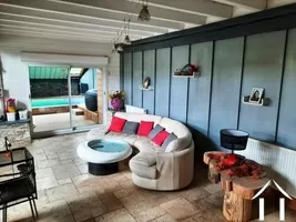 Living area with access to the pool room