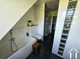 Bathroom with bath and shower