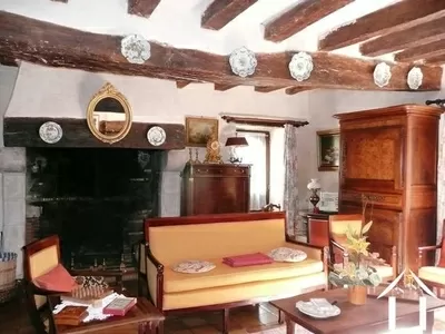 The lounge - it is here that you can sense the age of the property. From here you can directly access the outside staircase leading down from the dining terrace to the lane that winds down to the river. 