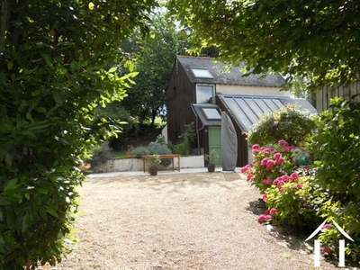 This is the modern style maison d'amis which could equally be used as a gîte. It is located at right angles to the main house and sits next to the large covered swimming pool.