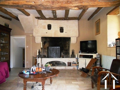 The large, feature fireplace. Beyond (the doorway to the left) is the bureau/library.