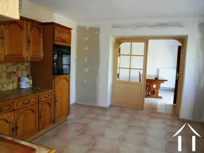 The kitchen is literally at the centre of the home. It has large internal doors opening into the dining room.